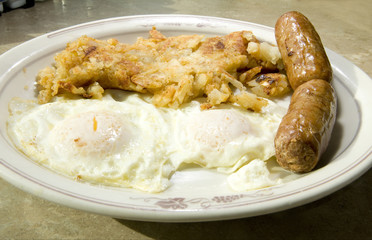 fried eggs over easy pork sausages home fried potatoes breakfast