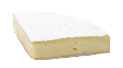 A piece of soft brie cheese