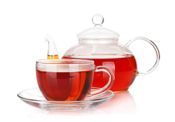 Glass cup and teapot of black tea