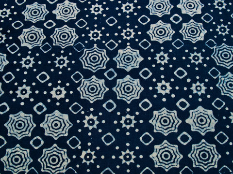 Blue batik fabric with repettition pattern as background from Yo
