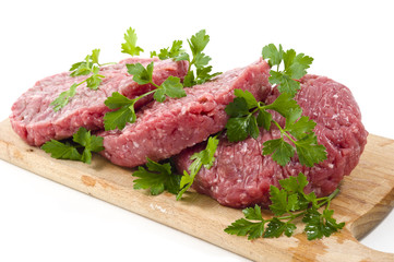Hamburger of beef on wooden board