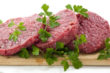 Hamburger of beef on wooden board