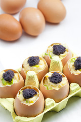 scrambled eggs with chives and black caviar