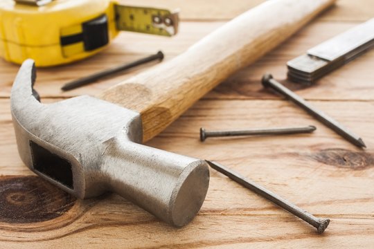 carpenter tools: hummer, tape measure, ruller and nails