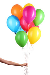 Hand holds colorful balloons isolated on white