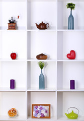 Beautiful white shelves with different home related objects