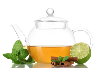 Teapot with mint,cinnamon and lime isolated on white