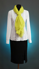 White blouse, black skirt and green scarf
