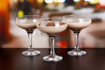 Cream cocktails on table in cafe