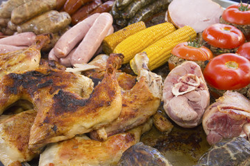 Assorted pieces of grilled vegetables, meat and chicken.