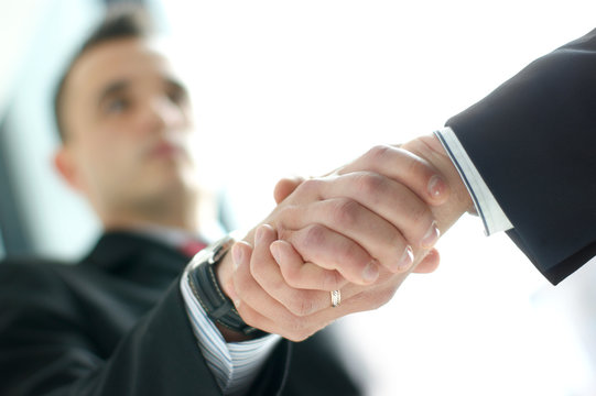 Close-up image of a handshake between two businesspersons