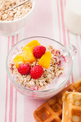 waffles, yogurt with muesli and fruits for breakfast