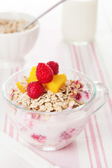 yogurt with muesli and fruits for breakfast