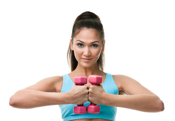 Sportive woman works out with pink weights, isolated on white