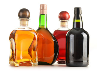 Composition with bottles of assorted alcoholic products isolated
