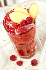 Red drink with raspberries and ginger