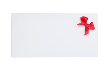 Envelope with red ribbon bow, isolated on white