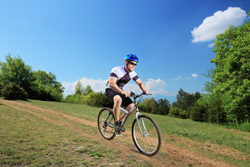 Fototapeta na wymiar Person riding a bicycle