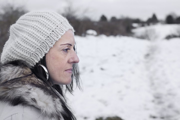 worried woman in snow covered fields