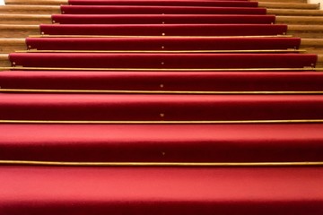 Red carpet on wooden steps