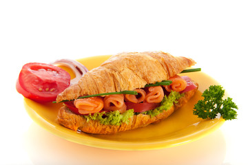 Croissant with salmon and vegetables