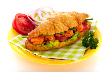 Croissant with salmon and vegetables