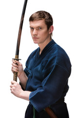 Kendoka in hakama hands bokken, isolated on white