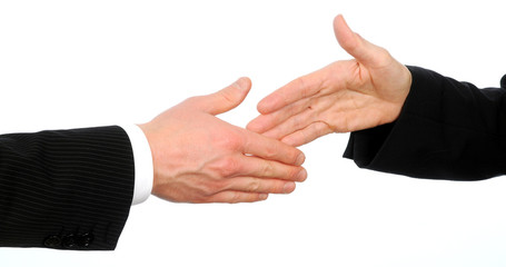 Obraz premium Closeup of male and female executives about to shake hands