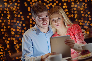 young couple with a tablet computer