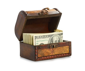 Dollar-bills in the old wooden treasure chest