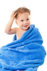 Smiling little boy in towel