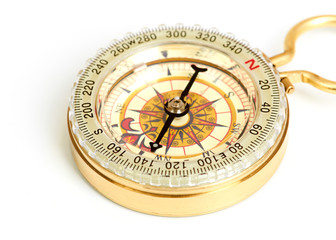 old styled, gold compass isolated on white background