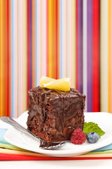 Cake with chocolate gloss on plate