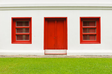 The old door and windows red on white wall
