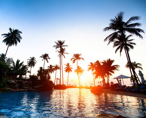 Naklejka na ściany i meble Beautiful sunset at a beach resort in the tropics