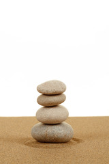 Fototapeta na wymiar Balance zen stones in sand on white