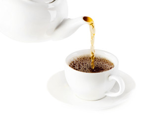 Tea being poured into tea cup