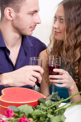 young couple  drinking red wine