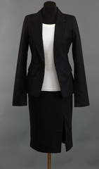 White blouse and black skirt with coat