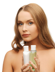 woman with cosmetic bottles