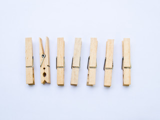 Wooden clothes clips isolated on white back ground
