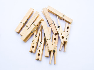 Wooden clothes clips isolated on white back ground