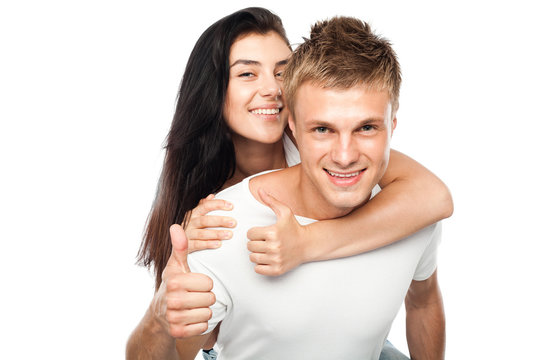 Happy young couple with his thump up