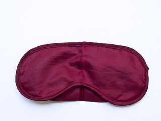 Crimson sleeping mask isolated on white background
