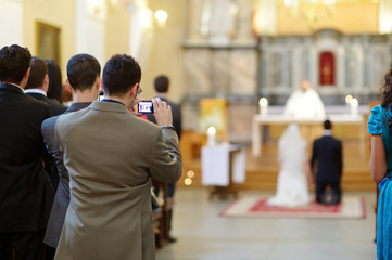 Wedding guest taking photos