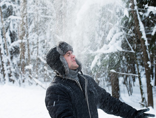 man throws the snow