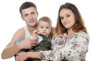 Portrait of a young happy family with the kid