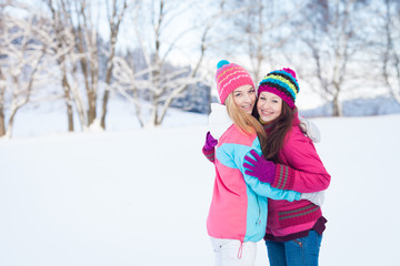Two young girl friends in winter outdoors. Holidays. Happy Teens - 48952453