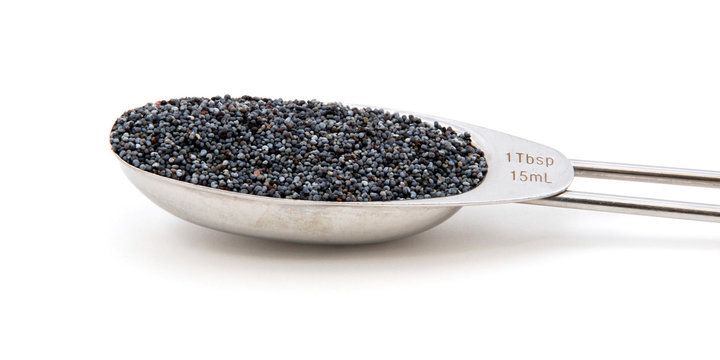 Poppy seeds measured in a metal tablespoon
