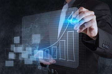 businessman hand drawing virtual chart business